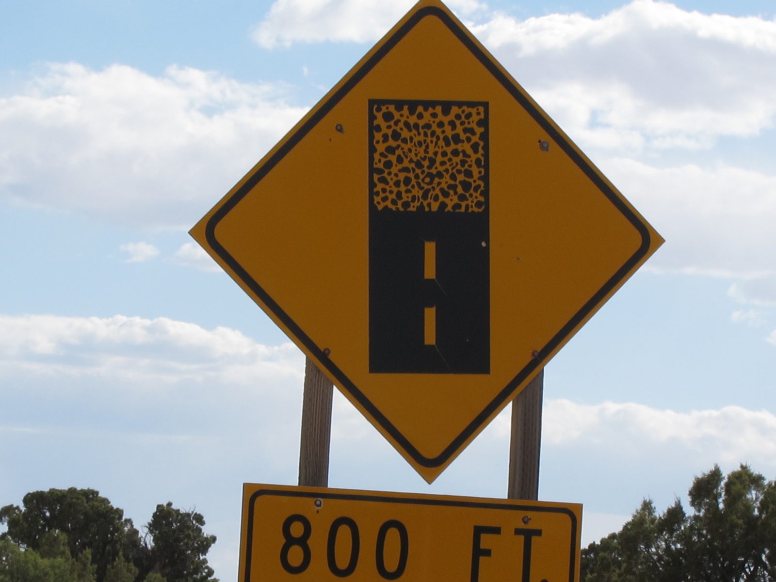 Great sign of Highway Bingo .... paved road ends, dirt ahead